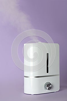 New air humidifier on violet background