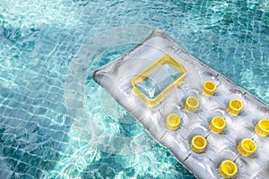 New air mattress floating on clear swimming pool water, summer concept