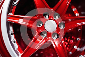 new alloy car wheel closeup, red color