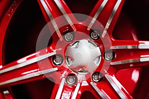 new alloy car wheel closeup, red color