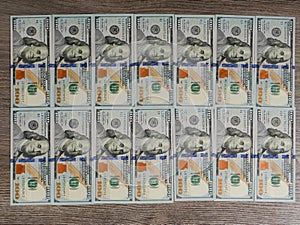 New American 100 dollar bills lying on the floor.