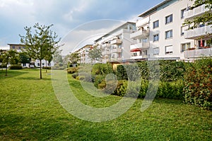 New apartment building, modern residential development with outdoor facilities in a green urban settlement