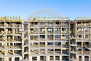 New apartment building under construction against blue sky background