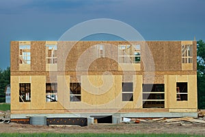 New apartment building under construction on sunny day on blue sky background