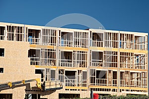 New apartment building under construction on sunny day on blue sky background