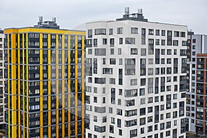 New apartment buildings with windows and balconies. Modern european complex