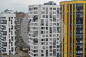 New apartment buildings with windows and balconies. Modern european complex