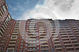 New apartment house . multi storey houses modern . High rise residential buildings under the blue sky . Facade of modern multi-