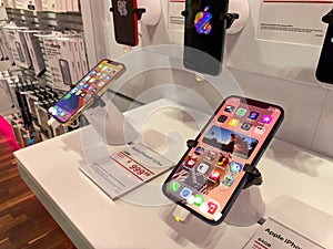 The new Apple iPhone 12 and 12 Pro on display at the T Mobile store
