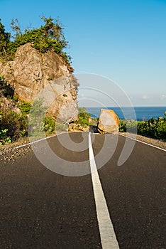 New asphalt road path blocked by land slide / rock fall.