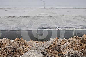 new asphalt road under construction in city, closeup of photo with selective focus