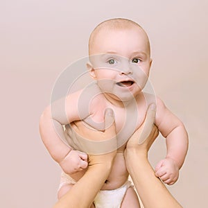 New baby infant. Happy small kid. Health portrait. Toddler relax. Diaper child. Mother hands