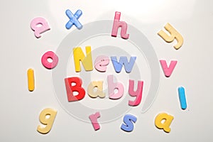 New baby spelt in magnet letters