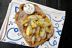 New baked potatoes with butter and thyme