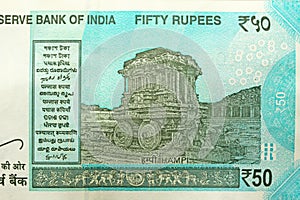 A new banknote of India with a denomination of 50 rupees. Indian currency. The other side, Hampi`s chariot