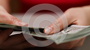 New banknotes in hands. Closeup businessman counting american cash money. Close-up shot of human hands counting american