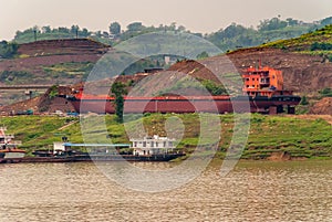 New barge under construction at shipyard on shore along Yangtze River, China