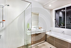 New bathroom with washing area including bath tub