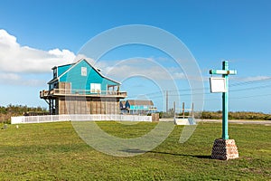 new beach houses at Port Bolivar on wooden stilts to protect against flooding, Texas