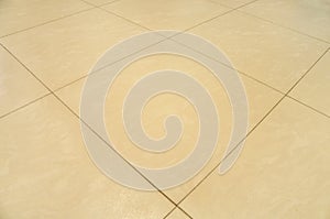 New beautiful sandstone texture background of ceramic wall and floor tiles in perspective