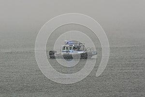 Patrol boat in snow flurry