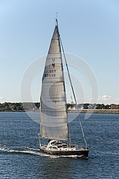 Sailboat Kismet crossing New Bedford outer harbor