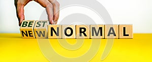 New best normal symbol. Hand turns cubes and changes words `new normal` to `best normal`. Business and Covid-19 postpandemic n