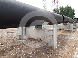 The new black metal pipe for raw water and steam  is overground