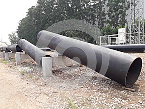 The new black metal pipe for raw water and steam  is overground