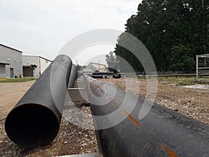 The new black metal pipe for raw water and steam  is overground