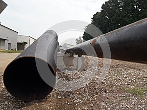 The new black metal pipe for raw water and steam is overground