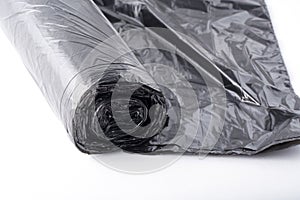 New black plastic garbage bag isolated on white background