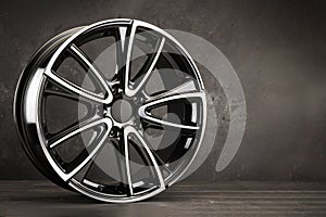 New black stylish alloy wheels, beautiful auto parts copy space,