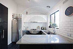 New black and white contemporary kitchen with subway tiles