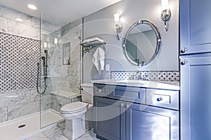New blue bathroom design with Marble shower Surround