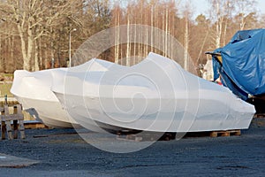New boats in plastic casing photo