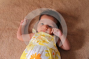 New born asian baby girl in cute dress