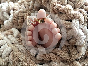 New Born Baby Feet with wedding rings