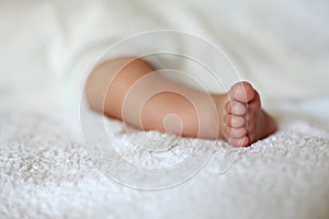 New Born Baby Foot on White Blanket