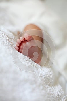 New Born Baby Foot on White Blanket