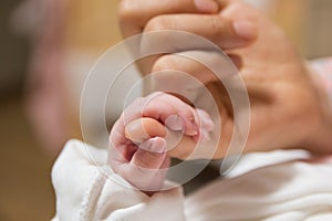 New born baby grip his mother& x27;s finger