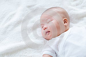 New born baby sleep with smile