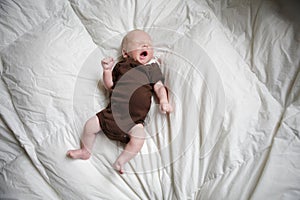 New born baby sleeping in his bed.