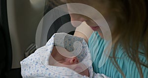 New born baby sleeping in mothers hands