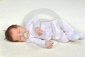 New born infant child baby girl sleeping