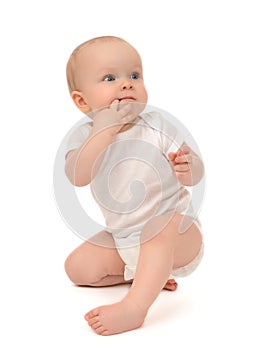 New born infant child baby toddler sitting or trying to stand up