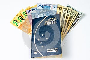 New brazilian passport, with American Dollar, and Reais Brazilian money. photo