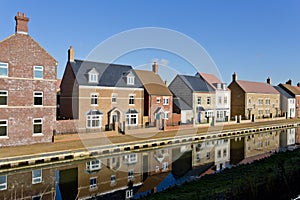 New build houses by a canal