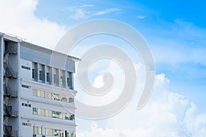 New building architecture with fire escape stairs on blue sky background