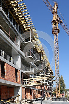 New building construction site with crane